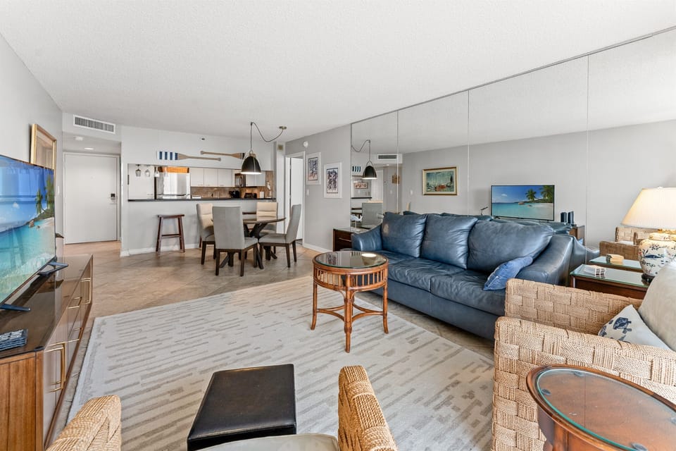 Spacious Living Room  with large TV and balcony access