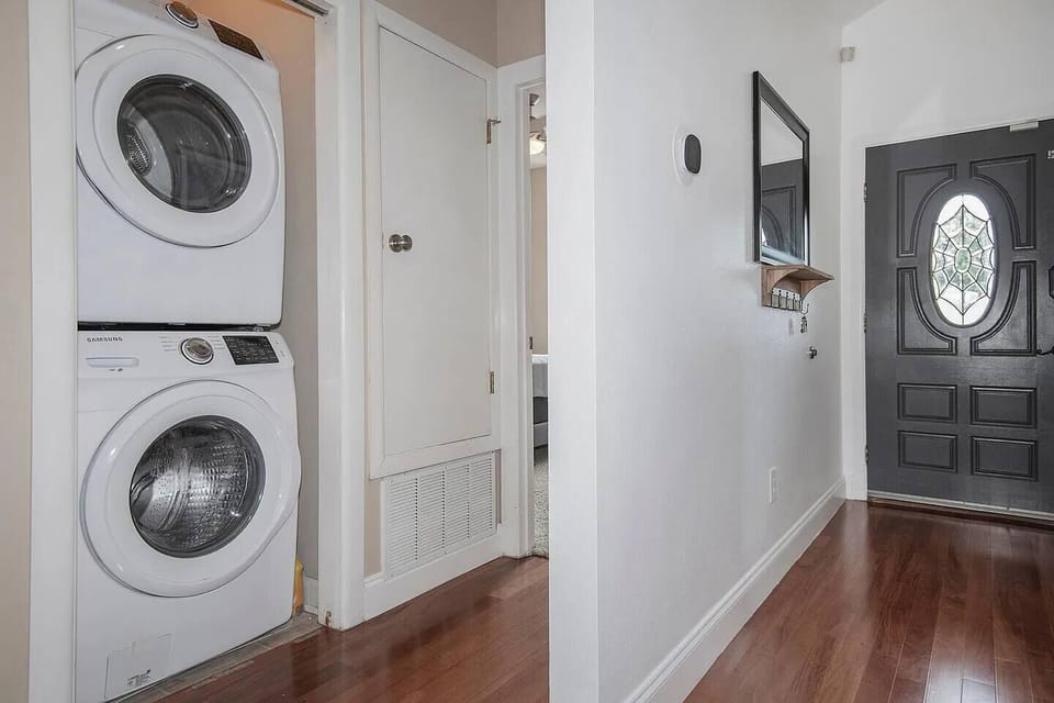 Travel light with the convenience of a stacked washer and dryer just off the hallway. The front entry offers a tidy drop zone with key hooks and a mirror to help you start every outing organized.
