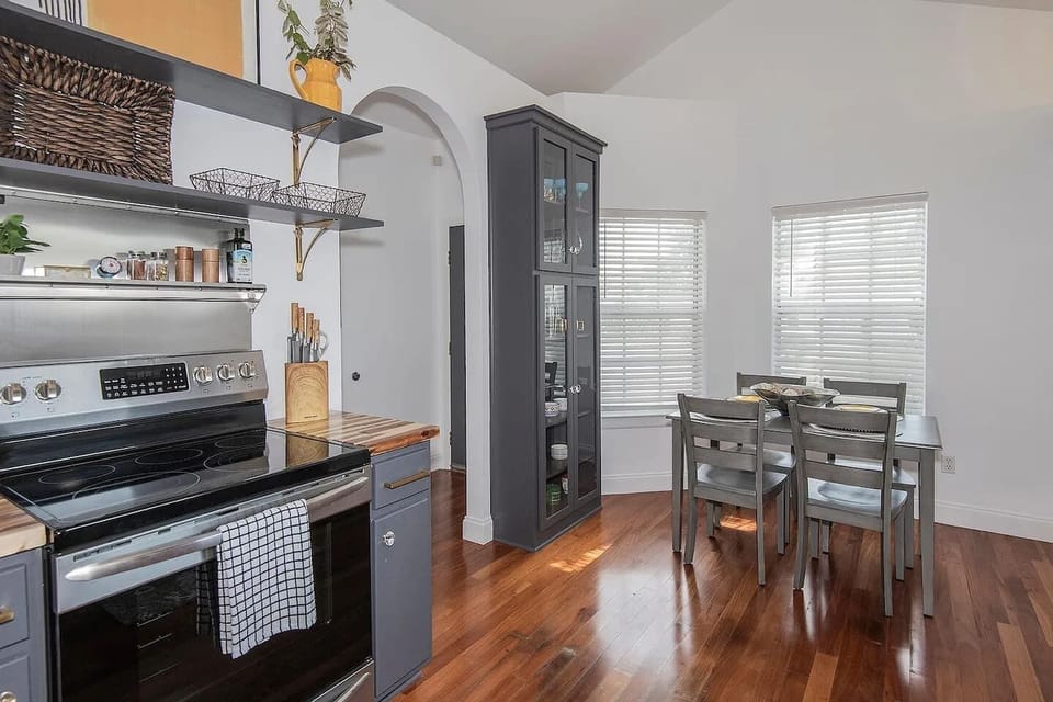 This bright, corner dining space comfortably seats four and is perfect for morning coffee, takeout nights, or homemade meals. Surrounded by natural light and just steps from the kitchen for effortless serving.