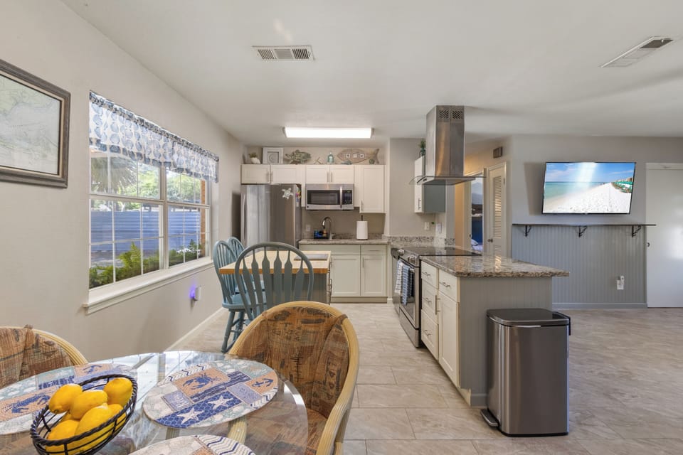 Enjoy a casual morning meal at the breakfast bar with views of the backyard, or gather in the dining nook for a group dinner.