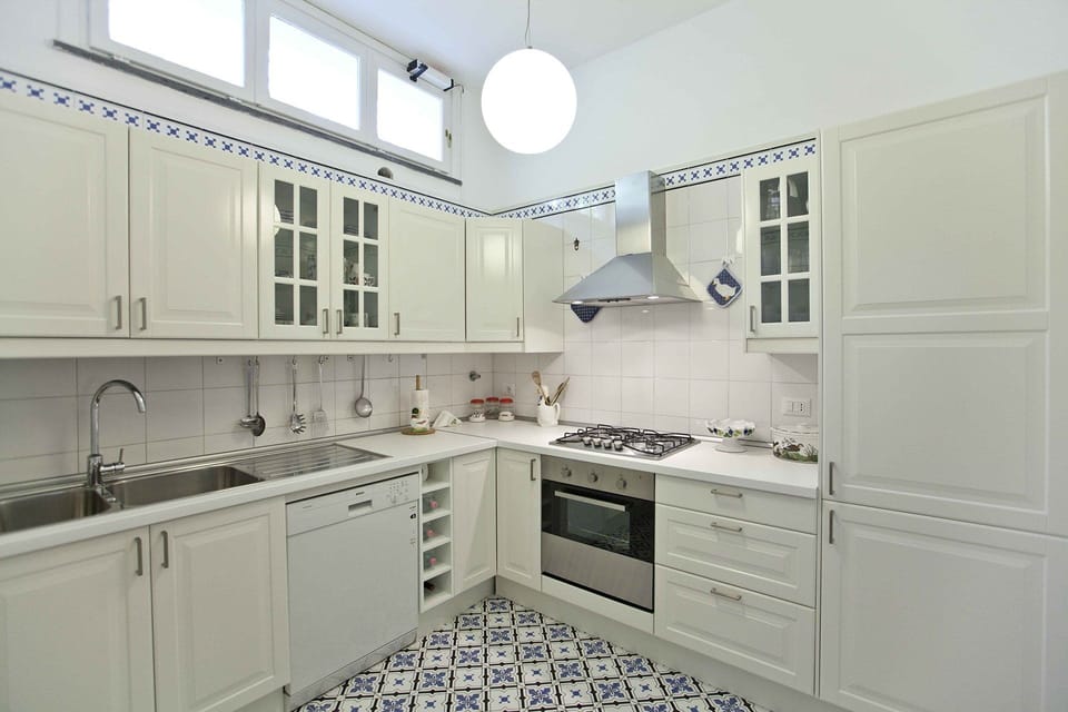 Kitchen, Countertop, Cabinetry, Kitchen Appliance, Flooring, Major Appliance, Interior Design, Floor, Kitchen Stove, Cupboard