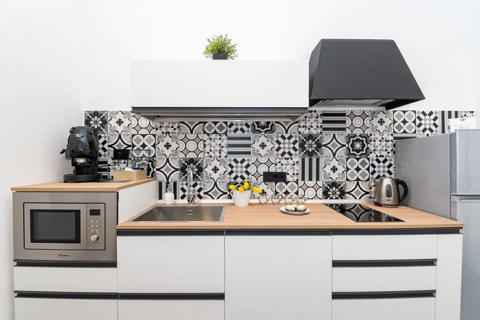 Kitchen, Countertop, Interior Design, Kitchen Appliance, Flooring, Cabinetry, Furniture, Floor, Room, Kitchen Stove