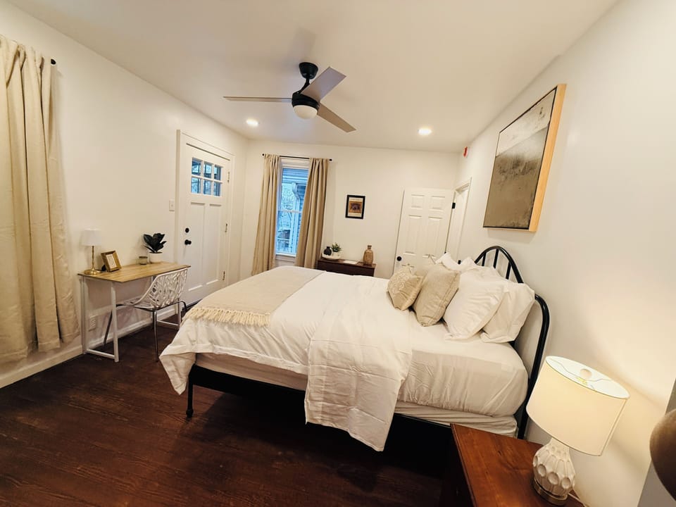 [Bed #1] Queen-sized comfort with dedicated workspace.