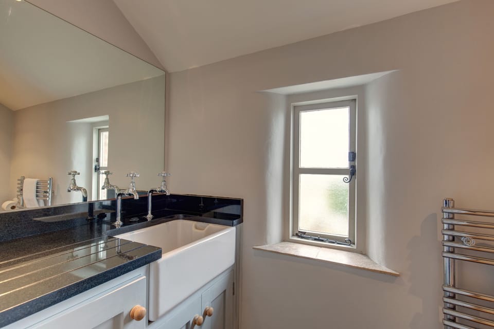 Ground floor: WC/ utility with Butler's sink, WC, heated towel rail and washer machine and tumble dryer