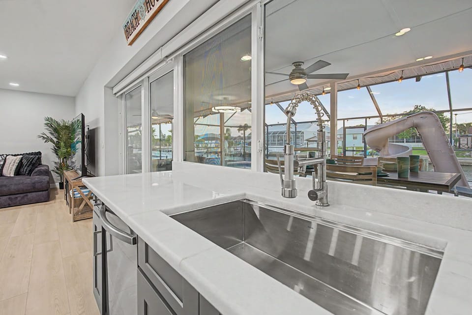 Dolphin Whispers Kitchen Sink with Pass Through Window to Covered Porch