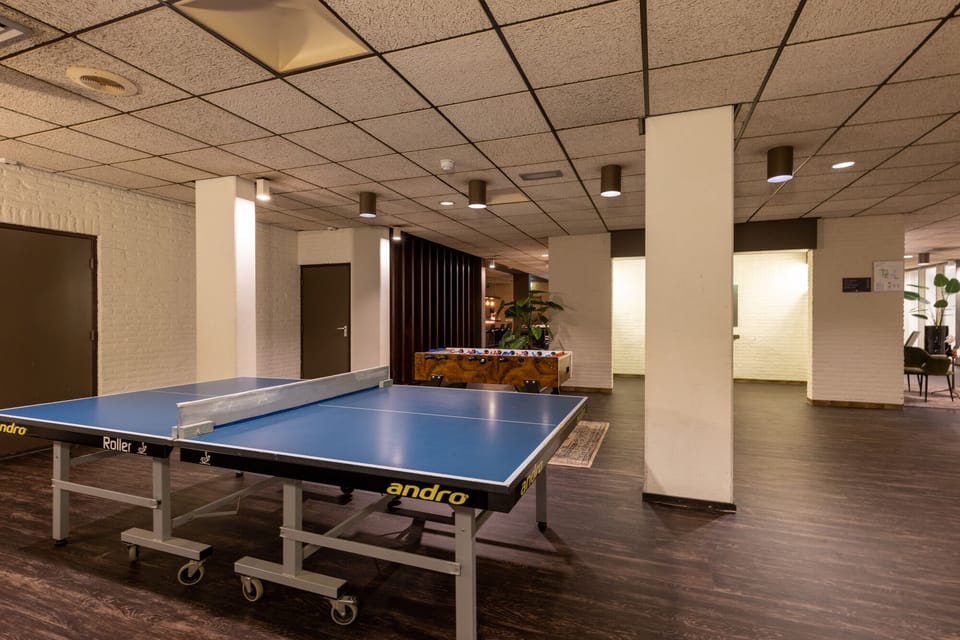 Challenge friends to ping-pong in a bright, casual hangout.