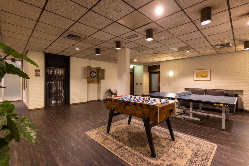 Gather for foosball and games in a relaxed lounge setting.