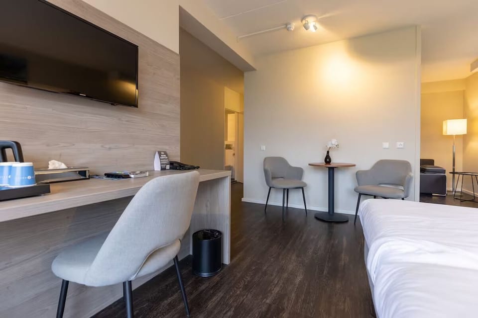 Catch up on work at the desk, then unwind in bed.