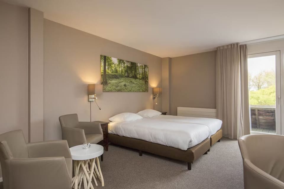 Relax in a spacious room with warm lighting and balcony.