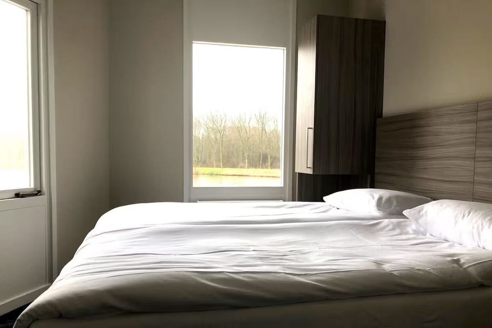 Unwind in crisp linens with calming countryside views.