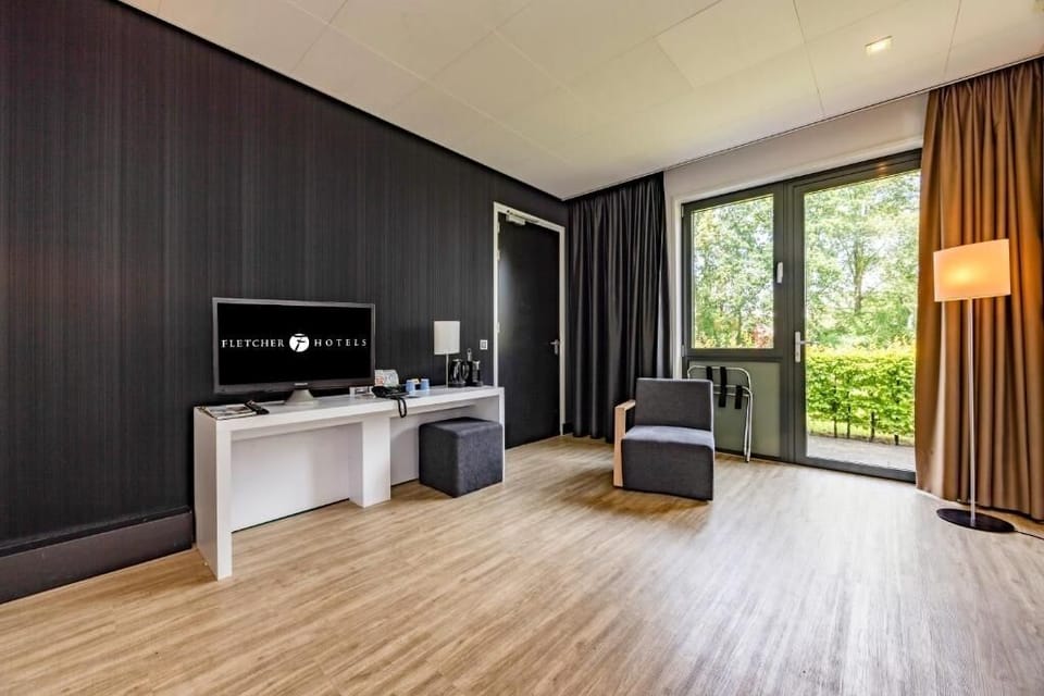 Stretch out with garden views, cozy seating, and in-room TV.