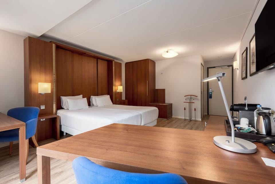 Spread out comfortably with a roomy desk and restful sleeping area.