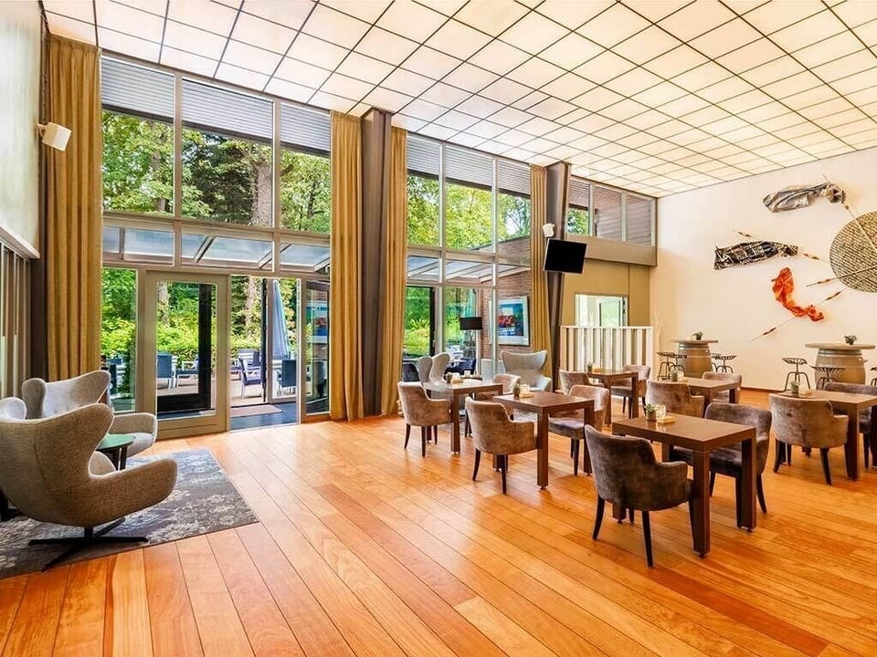 Start your morning in a sunlit dining room with garden views.