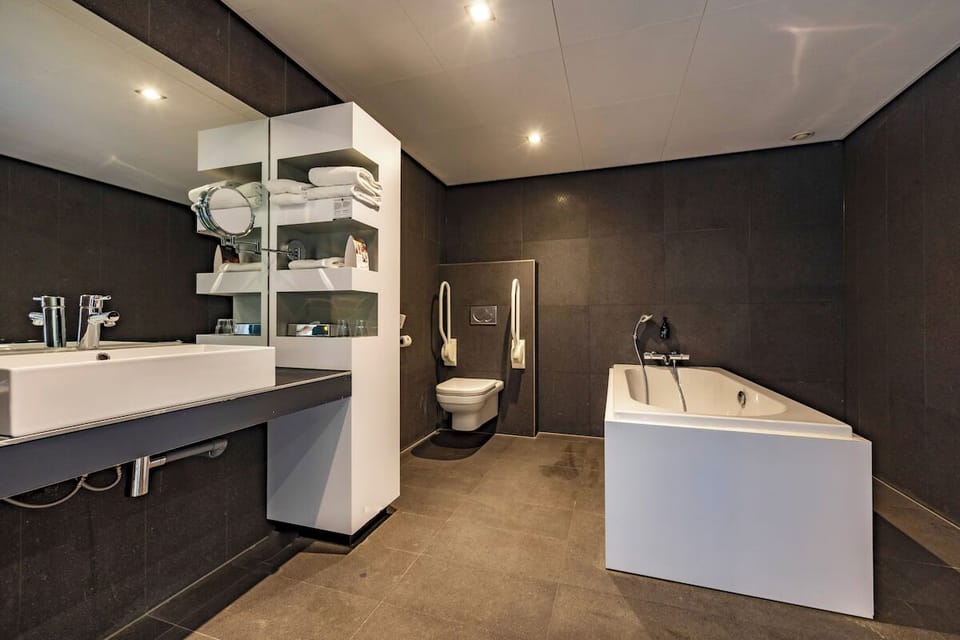 Indulge in a spacious spa bathroom with soaking tub.