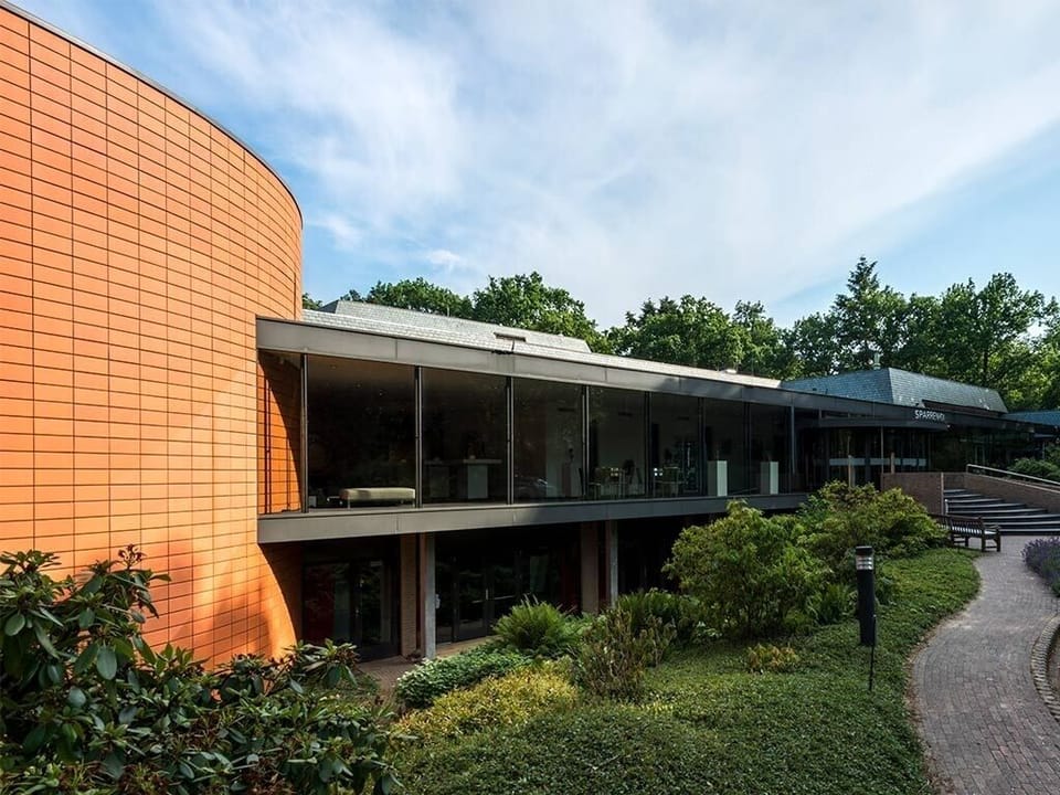 Arrive to a modern, nature-framed retreat with calming views.