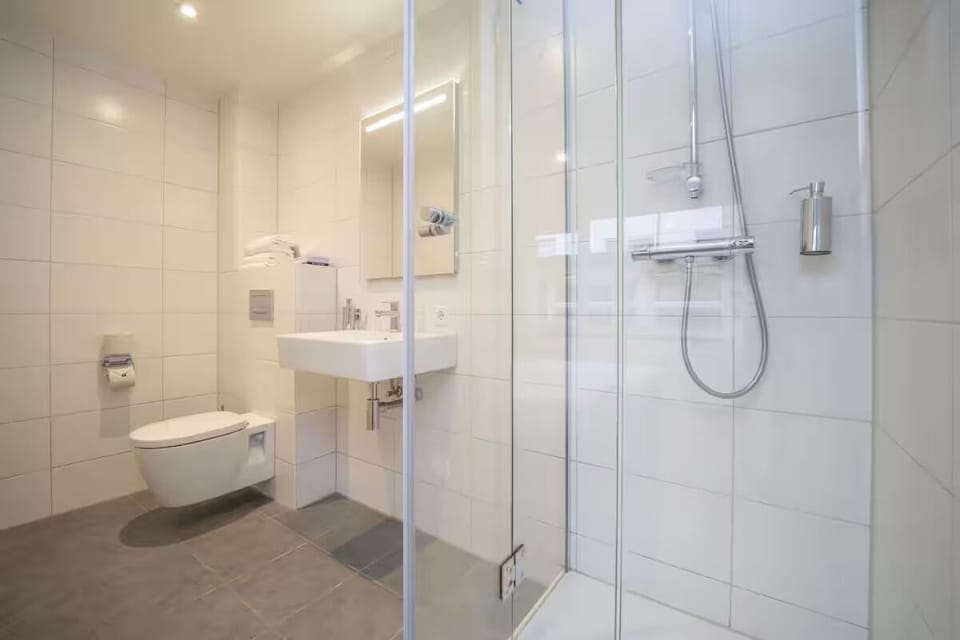 Enjoy an airy, spotless bath with roomy walk-in shower.