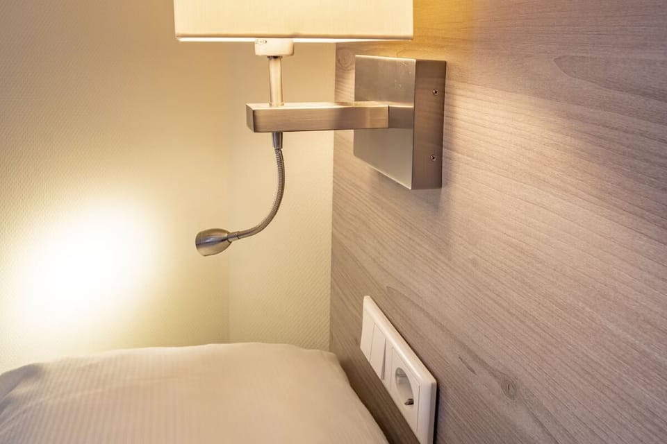 Curl up with a book under warm bedside lighting.