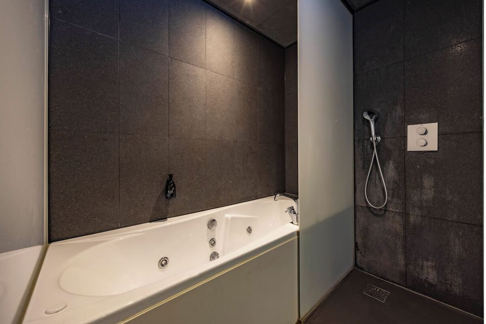 Soak and reset with a deep tub and rainfall shower.