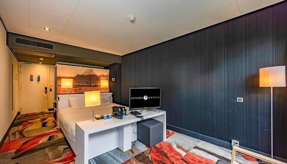 Settle in comfortably with a cozy bed and in-room essentials.
