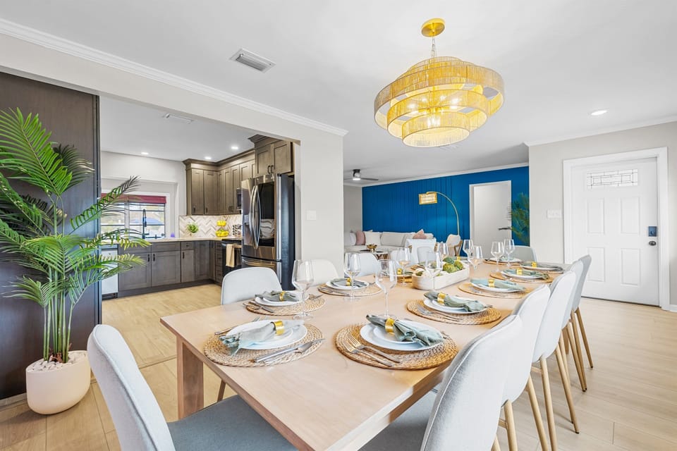 ⭐ "Every detail was thoughtfully planned — one of the best experiences we've ever had."
Beautiful open dining space with palm mural and seating for 12 — perfect for gathering, sharing meals, and enjoying vacation dinners together.