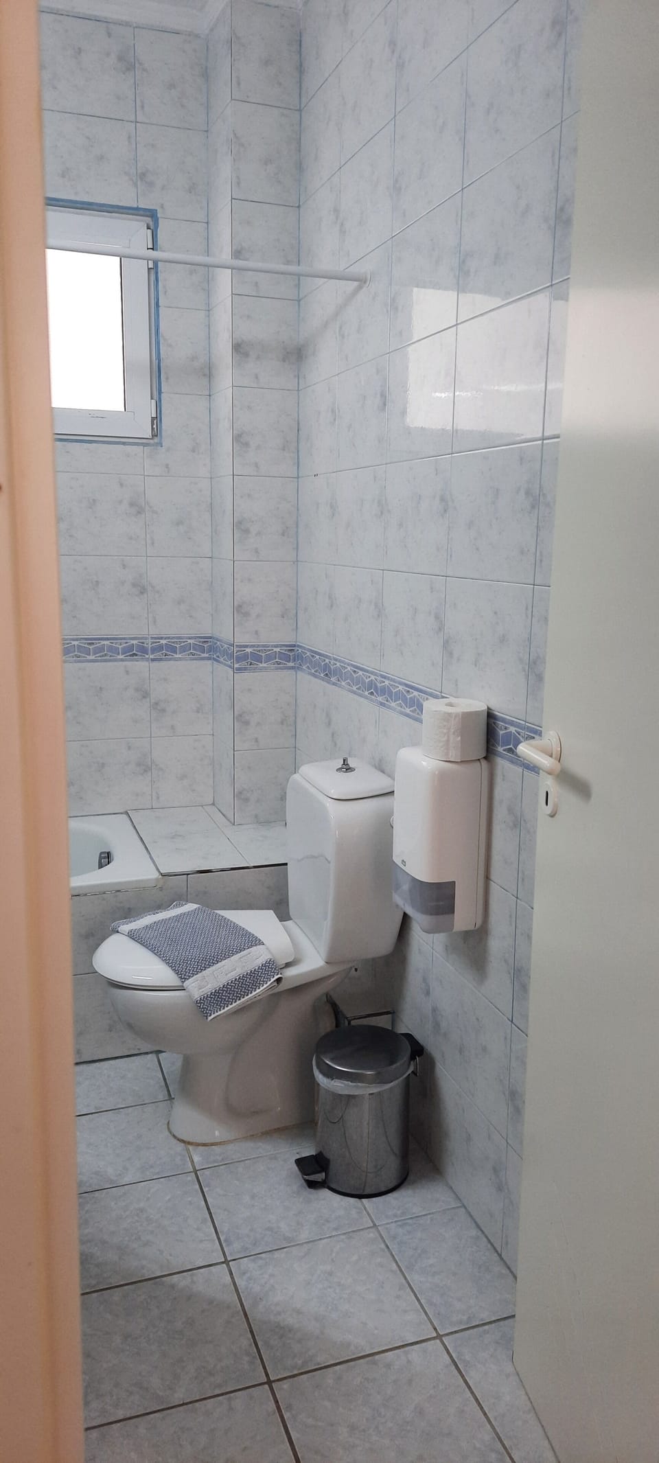 Bathtub, hair dryer, towels, soap