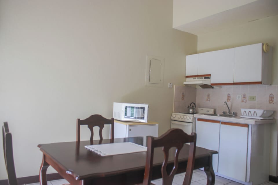 Economy Double Room, Balcony, Partial Sea View | Private kitchen | Fridge, microwave, stovetop, cookware/dishes/utensils