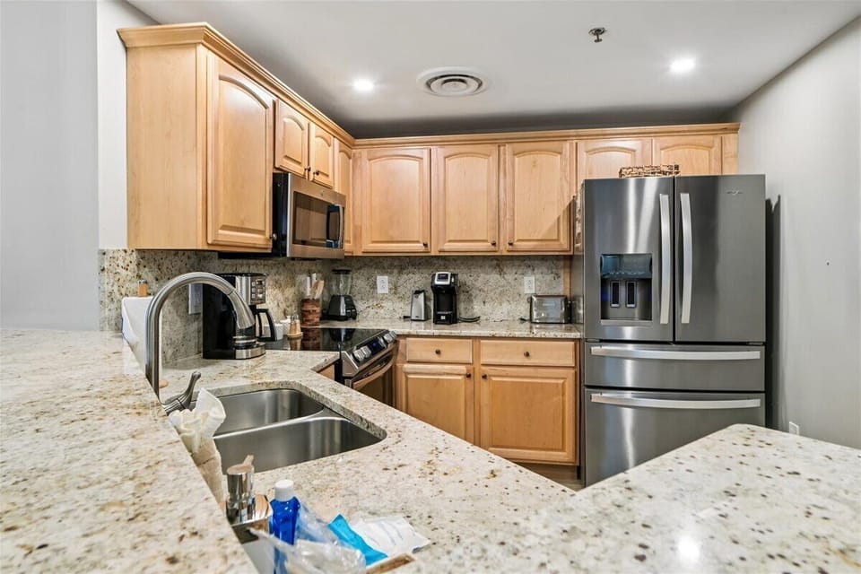 Your fully equipped kitchen awaits with granite counters, stainless appliances, and everything you need to create memorable meals during your stay.