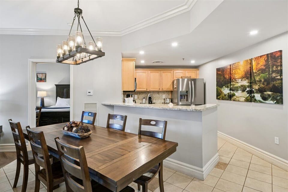 You'll love gathering around this warm dining table while your chef prepares meals in the open kitchen nearby.