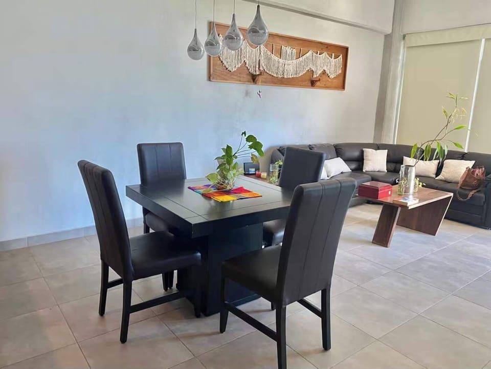 Dining area w/ sleek table setup ideal for shared meals & gatherings