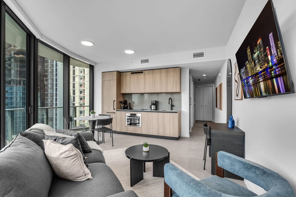 Modern city living at its best! This bright, open-concept studio features floor-to-ceiling windows with stunning skyline views, a sleek minimalist kitchen, and chic designer finishes. The perfect urban retreat for work or play.