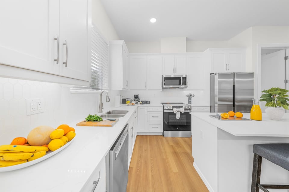 A well-equipped cooking station with stainless steel range and built-in microwave — no need to eat out every night.