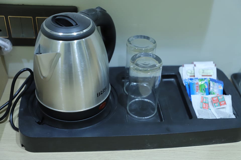Family Triple Room, City View | Coffee and/or coffee maker