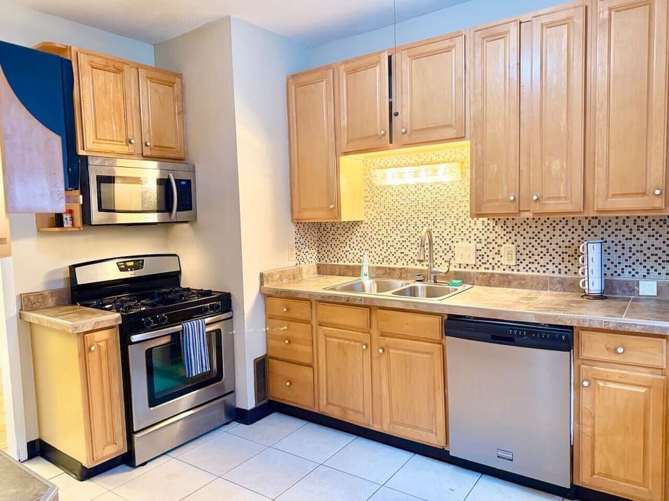 Bright, functional kitchen with ample counter space and cabinetry for storage. Features modern appliances and a practical layout, making it easy to cook, gather, and enjoy everyday meals.