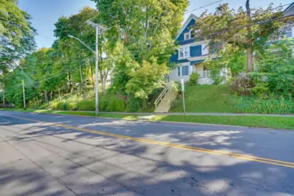 Charming exterior with inviting curb appeal, featuring classic details, warm tones, and a welcoming entry. Surrounded by greenery and thoughtful touches that create a cozy, attractive first impression.
