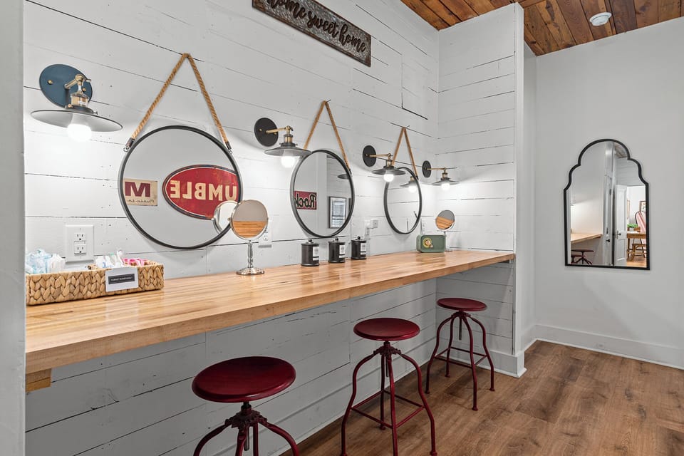 Get ready in style - this spacious vanity area features three mirrors and plenty of room for your group to get ready together. 