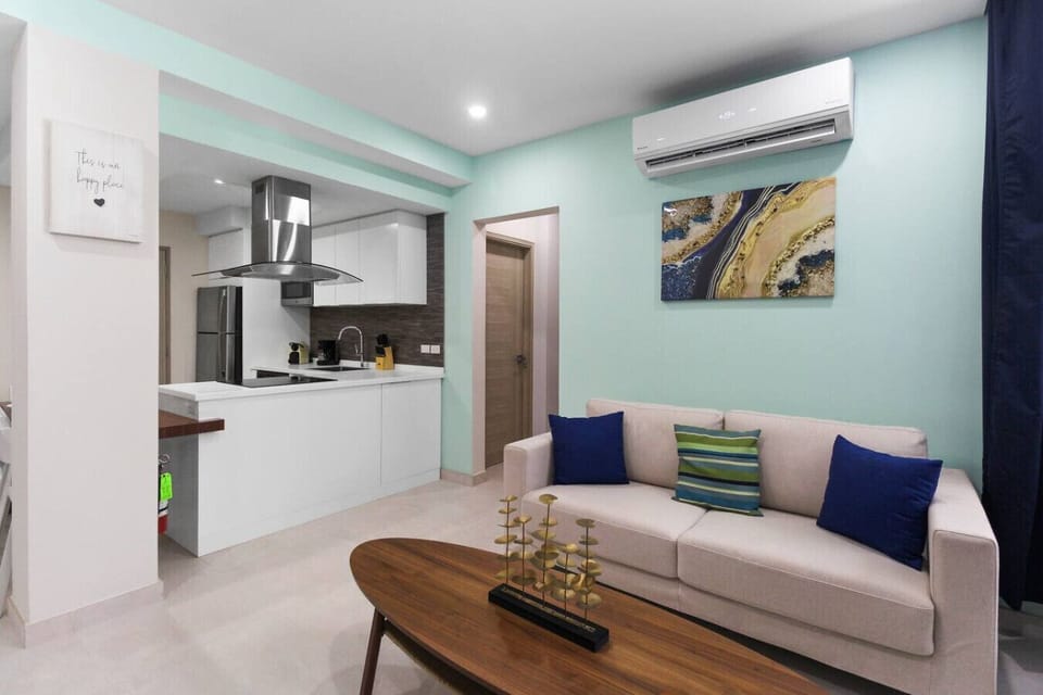 Bright and inviting living space with a fully equipped kitchen—perfect for relaxing, cooking, and enjoying your stay.