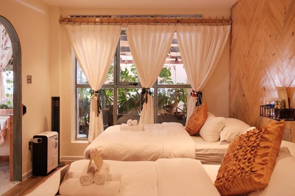 Quadruple Room, Garden View | Blackout drapes, iron/ironing board, free WiFi