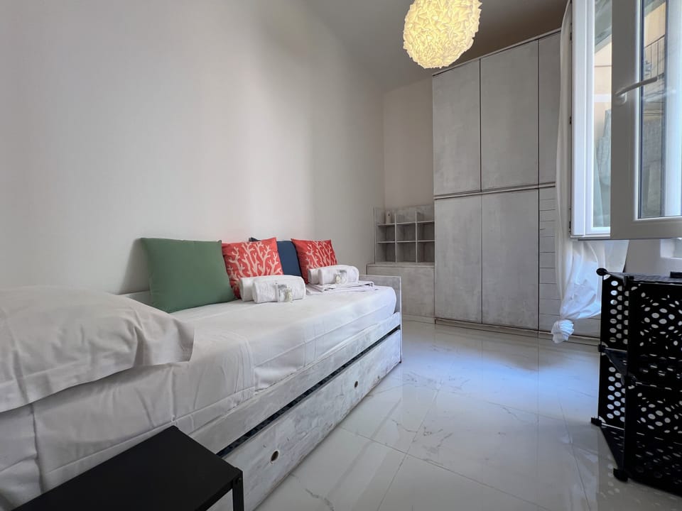 Deluxe Apartment, Courtyard View | Premium bedding, down comforters, blackout drapes, iron/ironing board