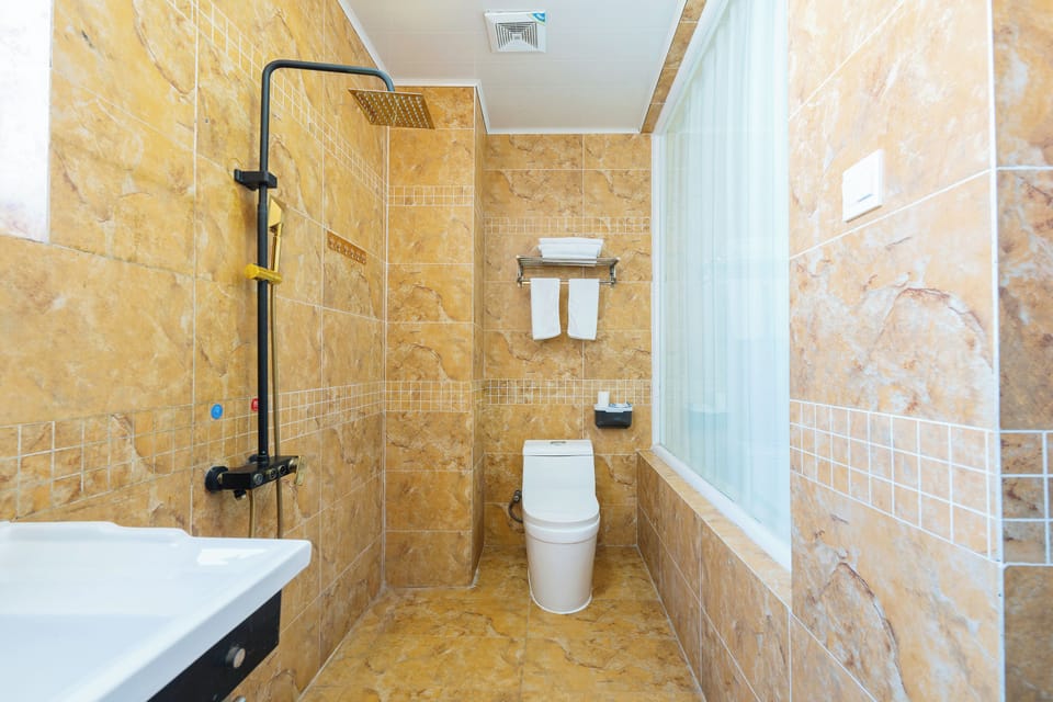 Shower, free toiletries, hair dryer, slippers