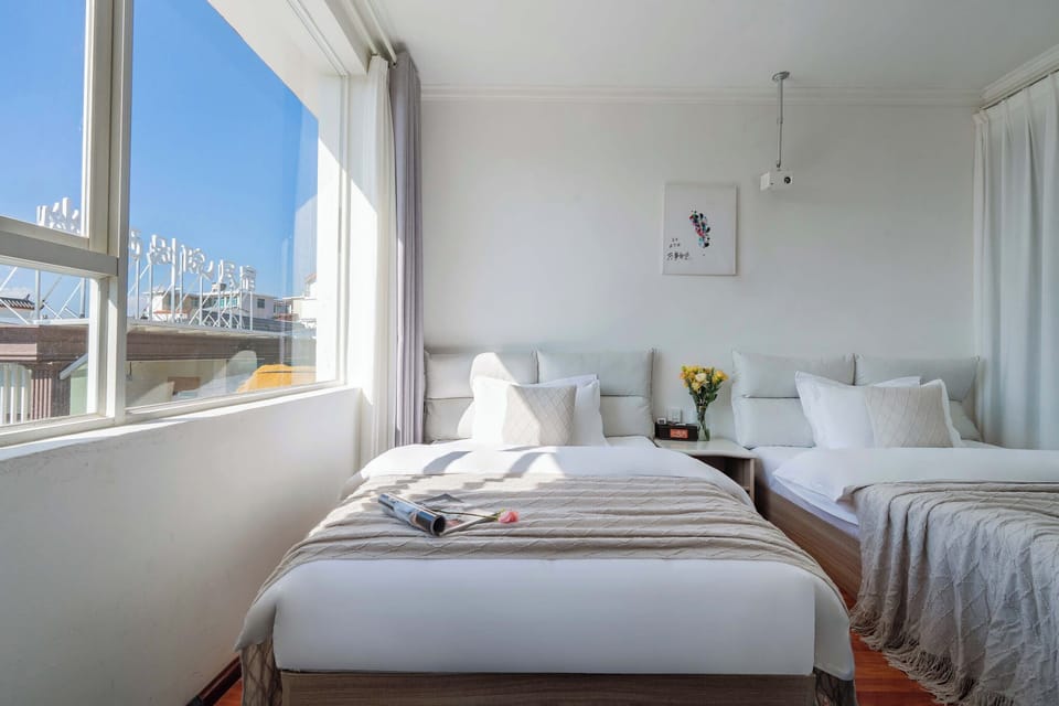 Luxury Twin Room, Courtyard View | Desk, laptop workspace, blackout drapes, soundproofing