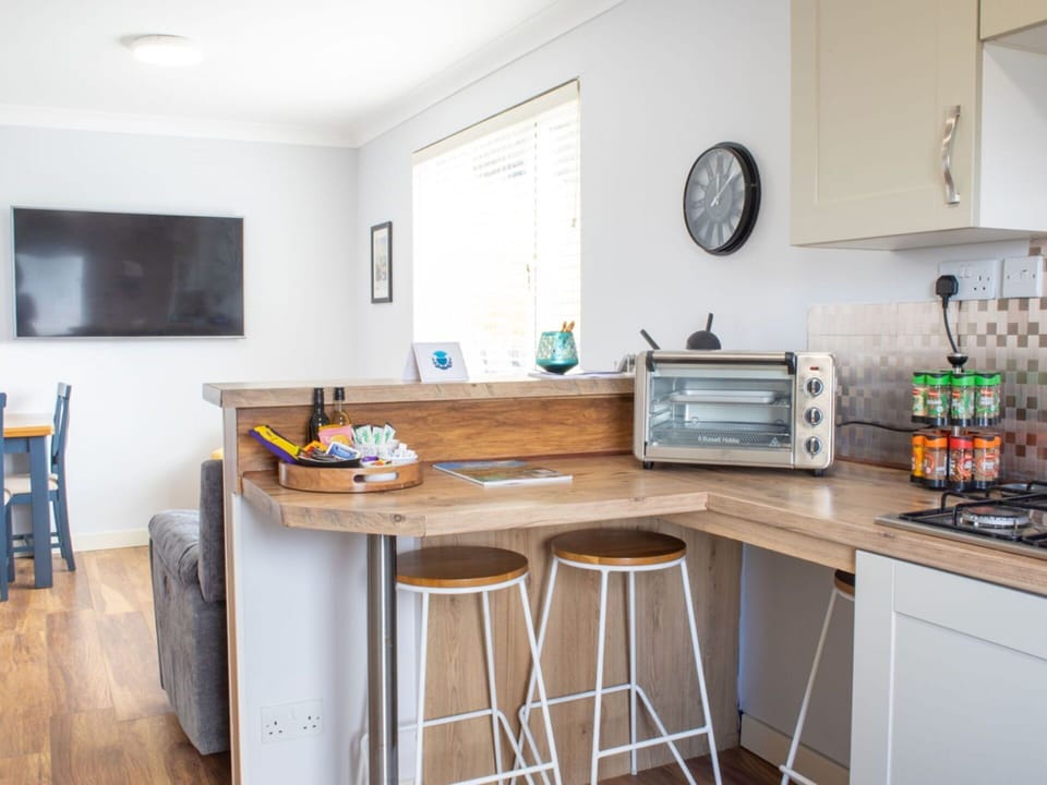 Furniture, Interior Design, Flooring, Countertop, Kitchen, Wood, Cabinetry, Floor, Kitchen Appliance, Major Appliance