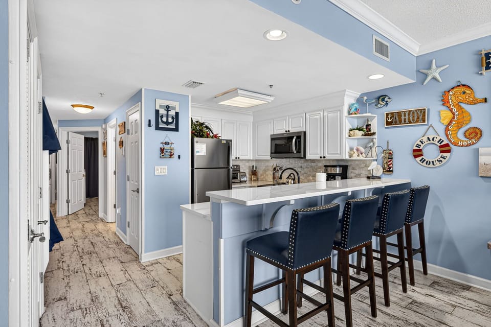 The recently updated, fully equipped kitchen features quartz countertops, stainless-steel appliances, and has everything you need to prepare meals for family & friends.