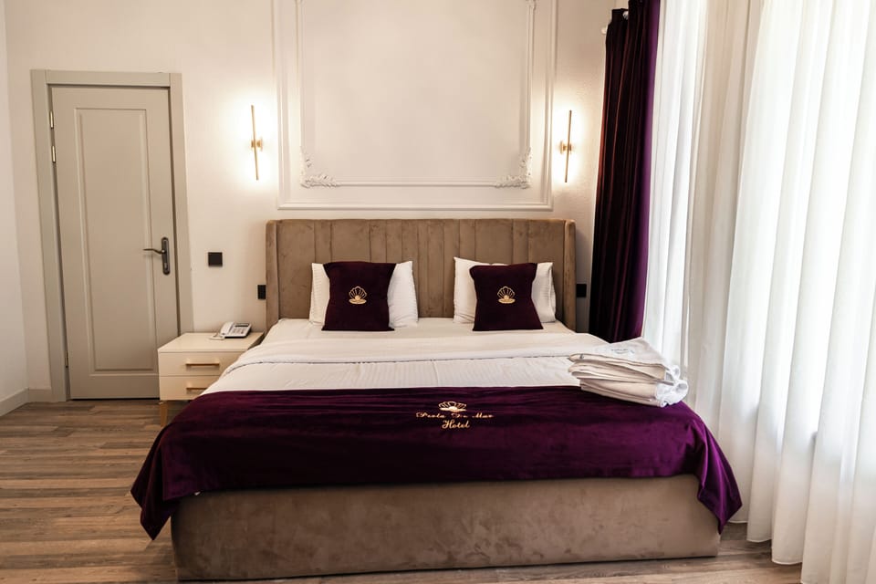 Deluxe Double Room, Balcony, Courtyard View | In-room safe, blackout drapes, soundproofing, iron/ironing board