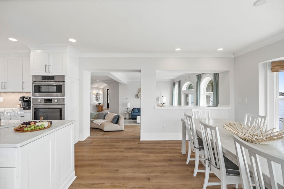 Open dining space just off the kitchen offers easy flow for gathering and entertaining