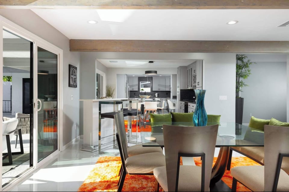 Sunlit dining with seamless indoor flow