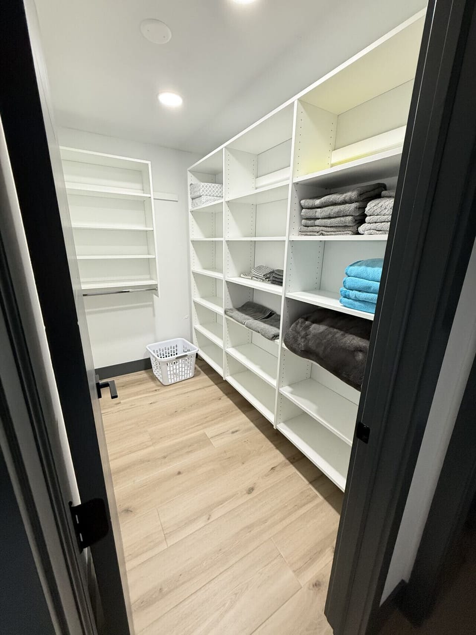 Primary bedroom walk-in closet