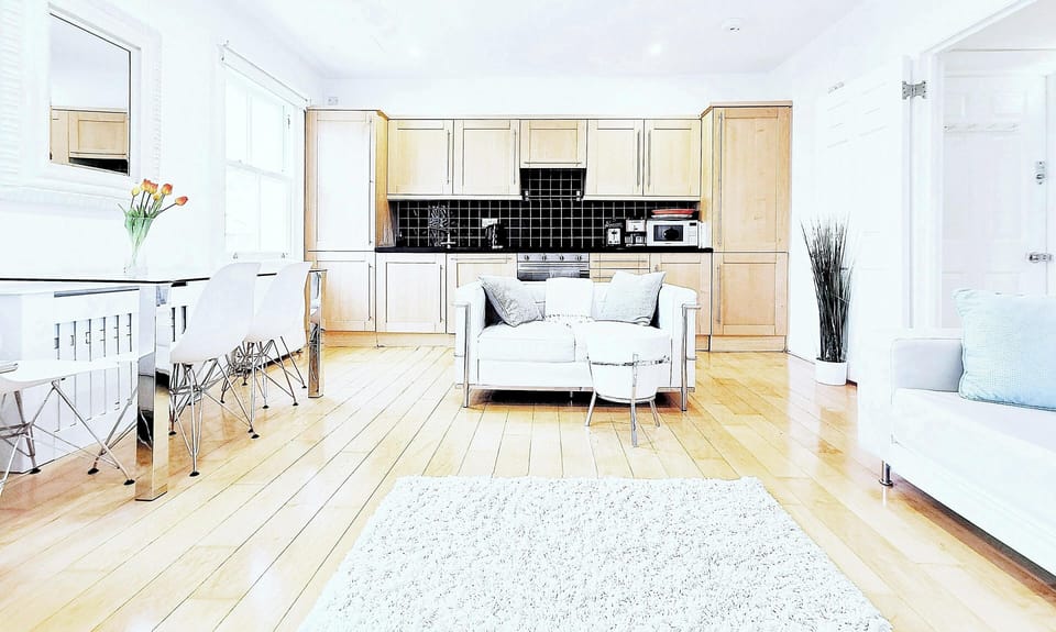 Large bright living with real wood Canadian maple floor