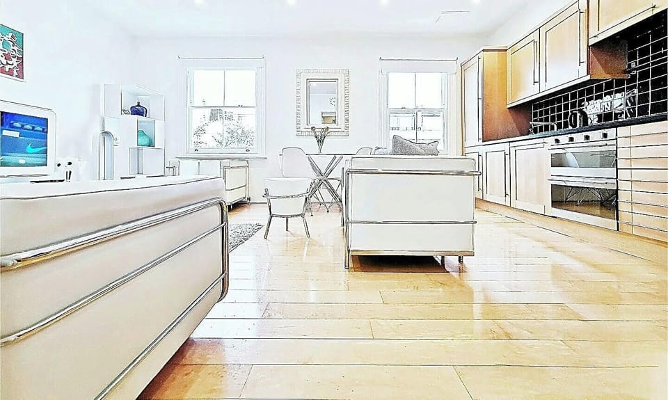 Large bright living with real wood Canadian maple floor