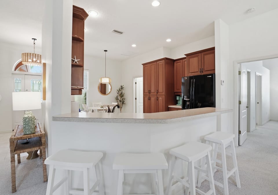Plenty of seating around the kitchen counter top 