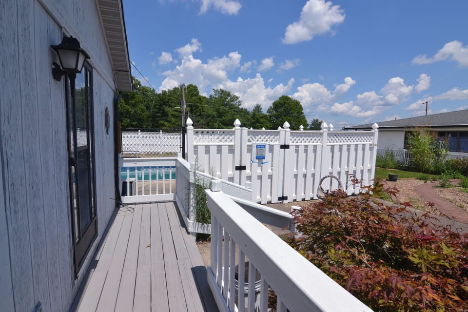 fence, outdoor pool, summer, outdoor, shared space, pool visible, daytime